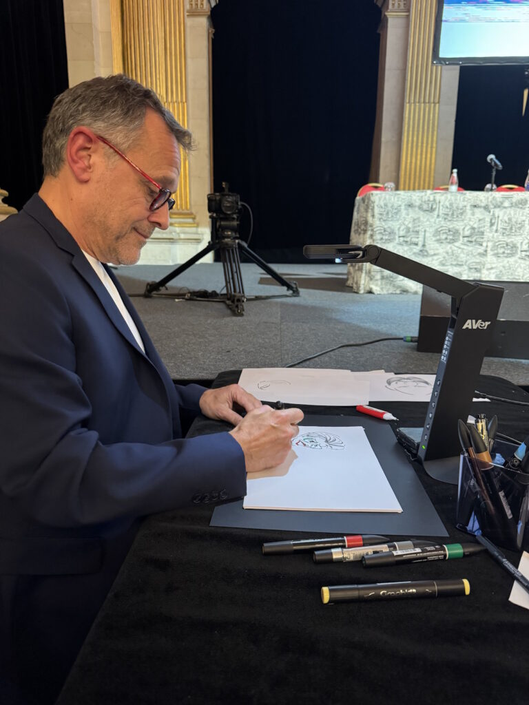 Illustrateur dessinant une caricature lors d’un événement